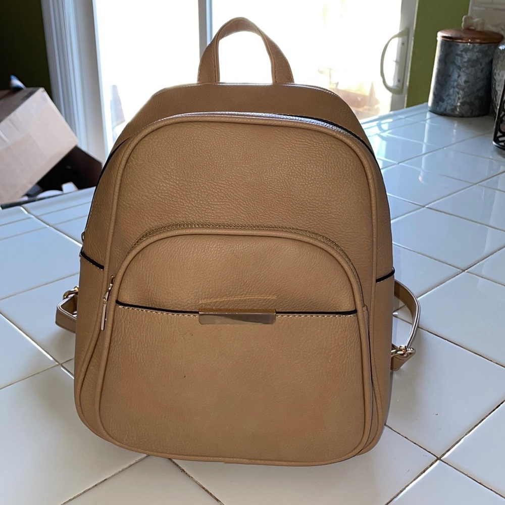 Medium size tan leather backpack